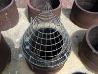 bird guard installed on chimney pot