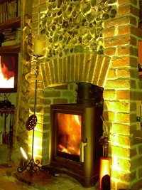 Broseley eVoulution 5 stove on brick hearth in flint fireplace