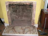 Fireplace enlarged to builders opening