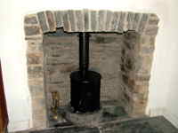 Machine Mart barrel wood burner in a house in Aberystwth
