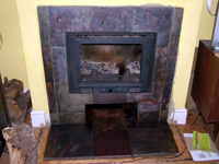 inset wood burner with slate surround